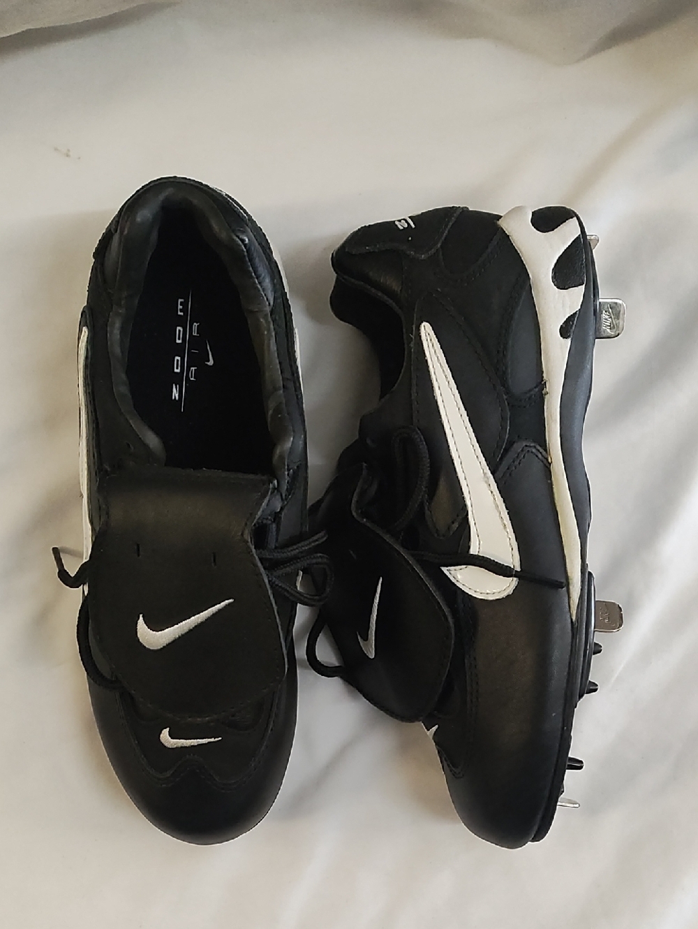 Nike Men’s Black and White Athletic Cleats with Metal Spikes